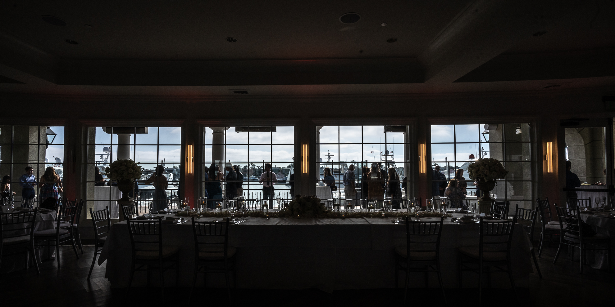 Thomas Kim's Los Angeles wedding reception with large windows overlooking the water.