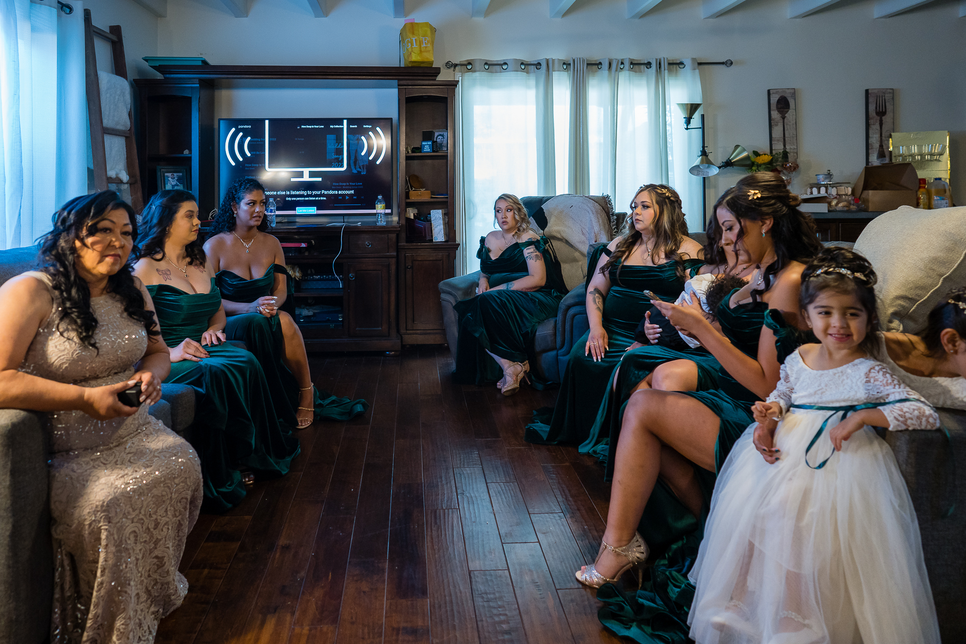 ThomasKim_photography Bridesmaids relaxing in a living room watching tv.