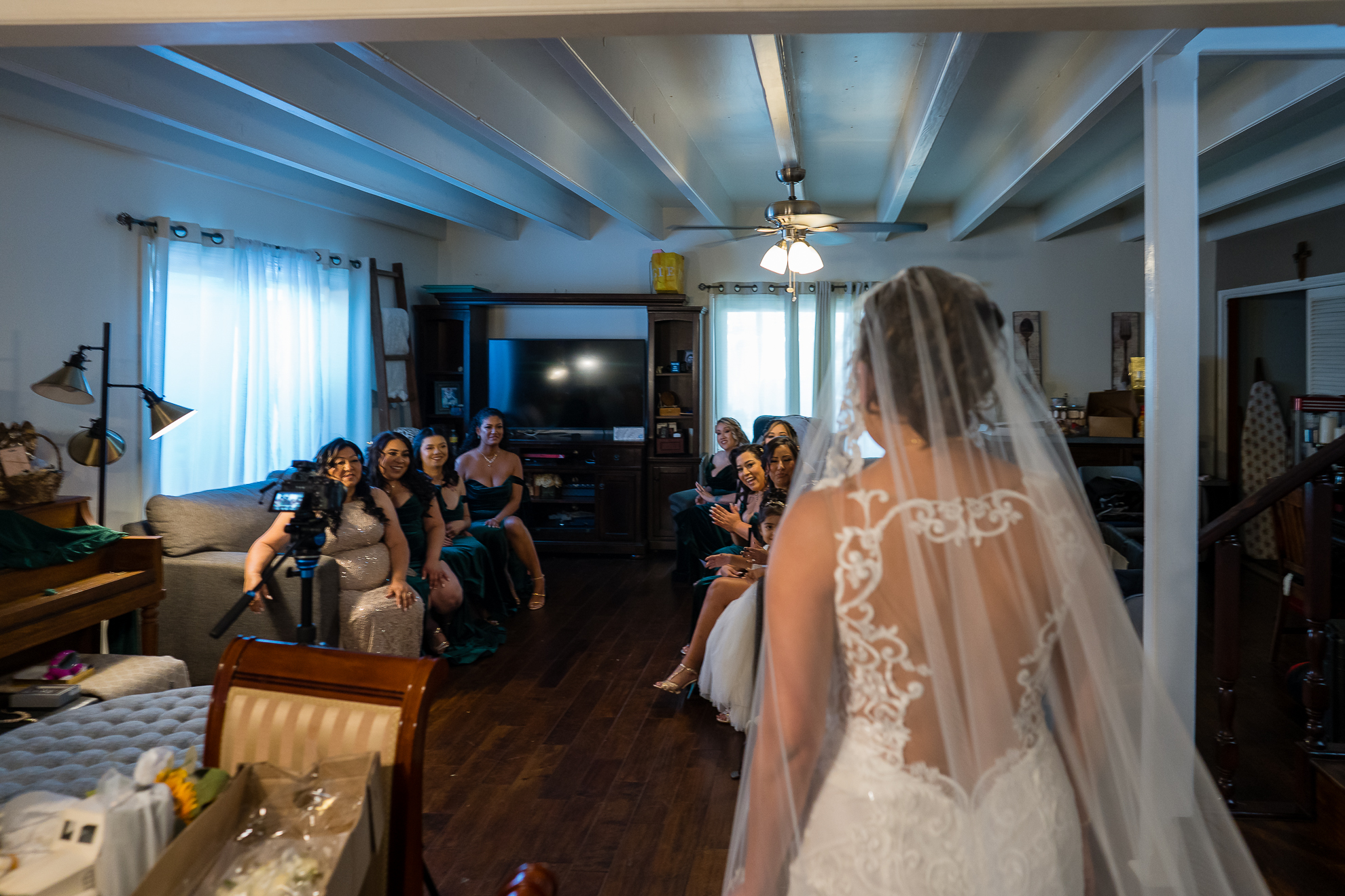 ThomasKim_photography A bride walks down the S aisle in front of a room full of A people.