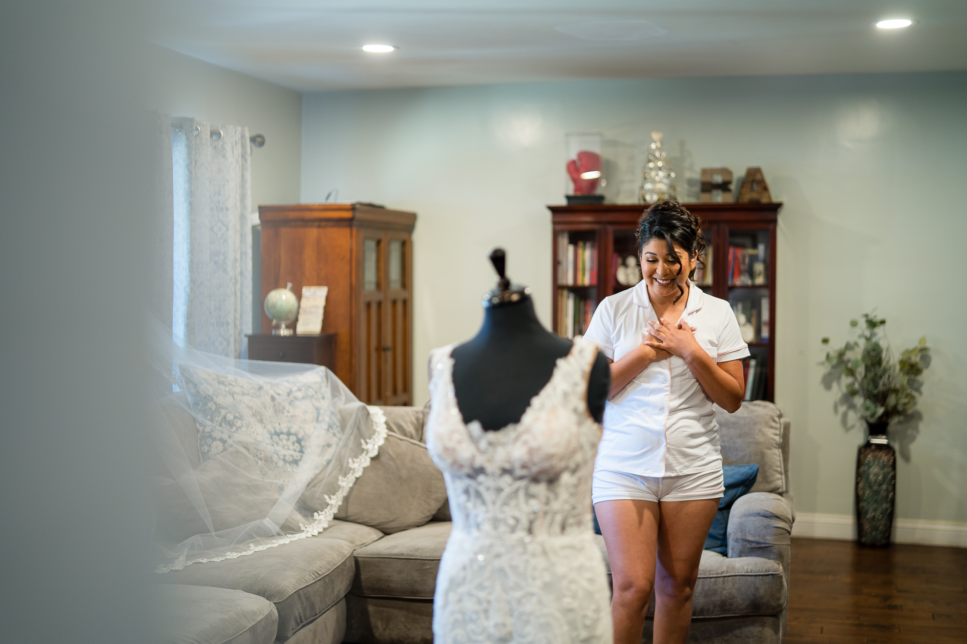 ThomasKim_photography A bride getting ready in a living room.