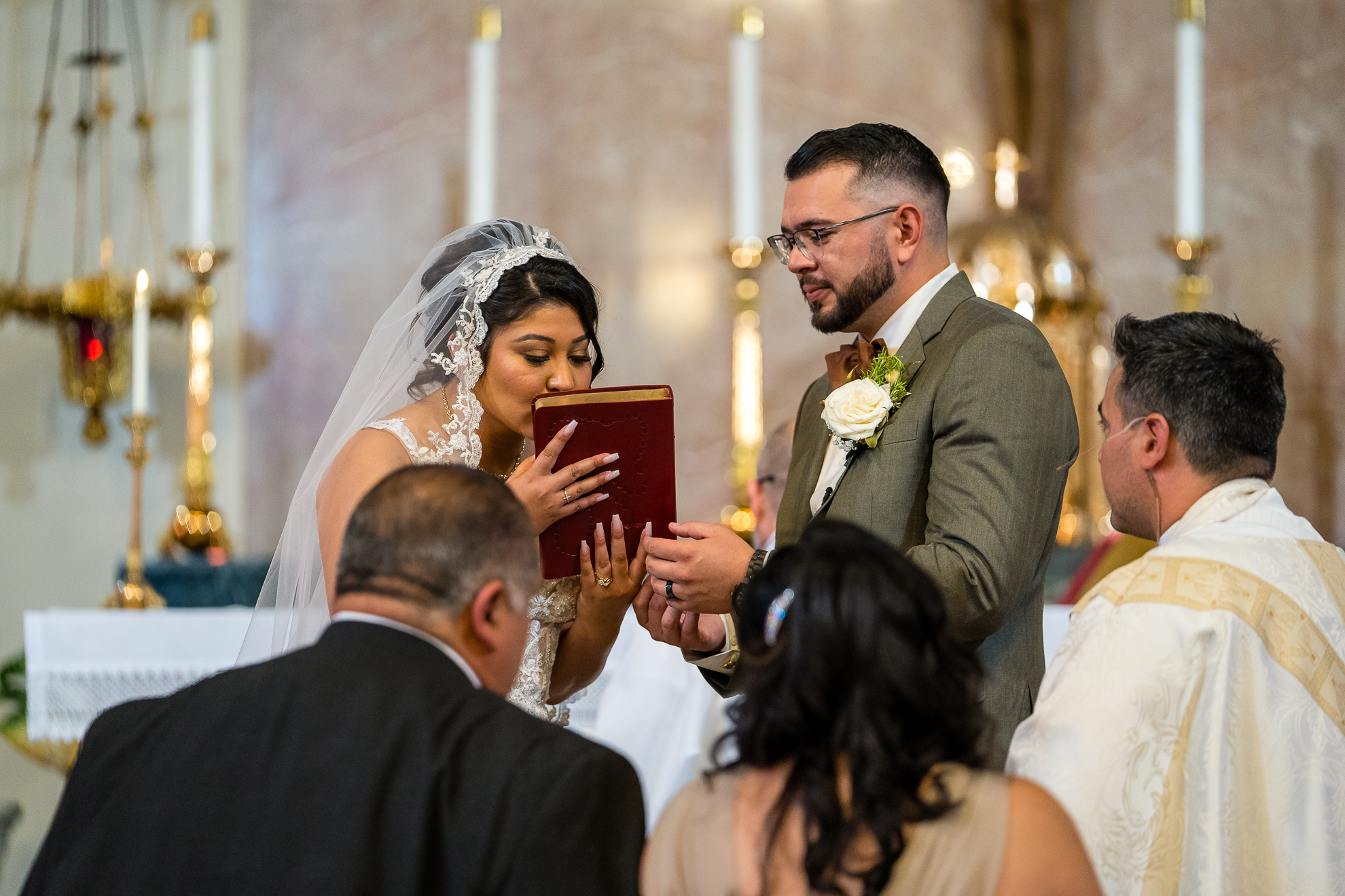 ThomasKim_photography A bride and groom exchange their wedding vows in a church. (S & A)